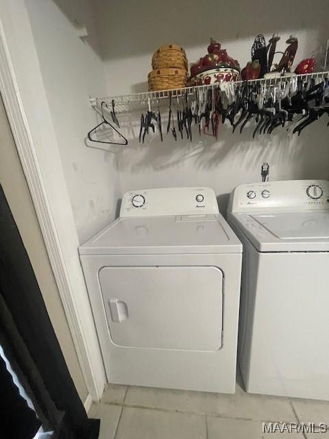 3440 Wickham Rd, Montgomery, AL 36116 - laundry area featuring washing machine and dryer and light tile patterned floors