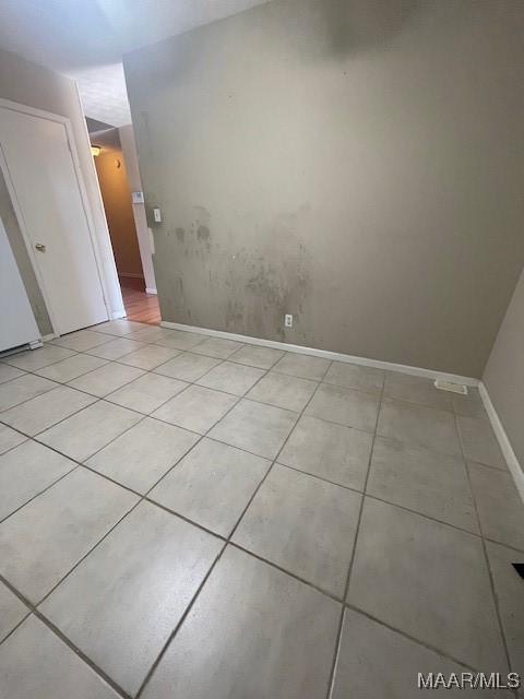 3440 Wickham Rd, Montgomery, AL 36116 - unfurnished room with light tile patterned floors and baseboards