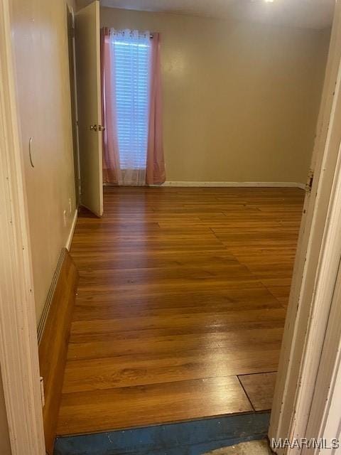 3440 Wickham Rd, Montgomery, AL 36116 - empty room with wood finished floors and baseboards