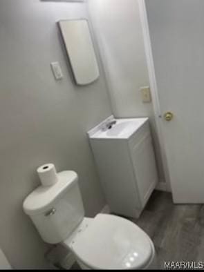 713 W Patton Ave, Montgomery, AL 36105 - half bathroom featuring wood finished floors and vanity
