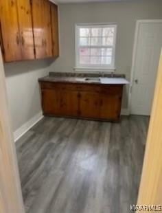 713 W Patton Ave, Montgomery, AL 36105 - kitchen featuring brown cabinetry and dark wood-style flooring
