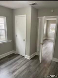 713 W Patton Ave, Montgomery, AL 36105 - unfurnished bedroom with wood finished floors and baseboards