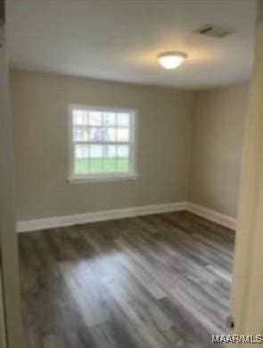 713 W Patton Ave, Montgomery, AL 36105 - spare room with wood finished floors and baseboards