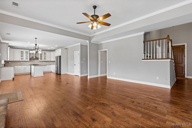59 Gresham Dr, Millbrook, AL 36054 - unfurnished living room with a ceiling fan, a chandelier, dark wood-type flooring, crown molding, and recessed lighting