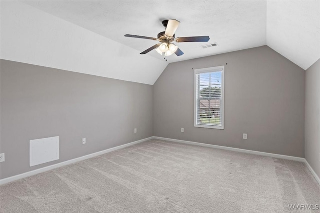 59 Gresham Dr, Millbrook, AL 36054 - additional living space featuring vaulted ceiling, ceiling fan, and light colored carpet