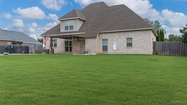 59 Gresham Dr, Millbrook, AL 36054 - rear view of house with brick siding, a fenced backyard, and a shingled roof