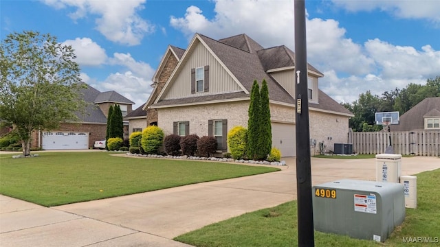 59 Gresham Dr, Millbrook, AL 36054 - view of property exterior featuring driveway, board and batten siding, brick siding, and a garage