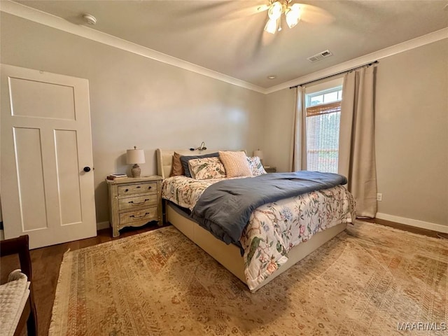 447 Cloverdale Rd, Greenville, AL 36037 - bedroom featuring crown molding, a ceiling fan, and wood finished floors