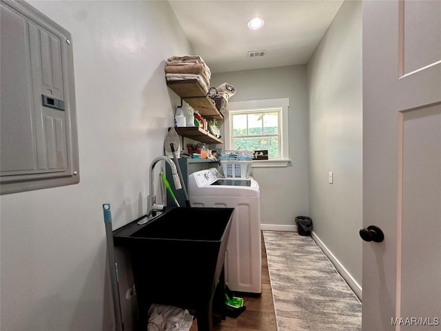 447 Cloverdale Rd, Greenville, AL 36037 - washroom with washing machine and clothes dryer, electric panel, and wood finished floors