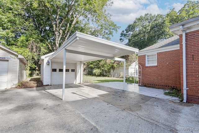 533 Morningview Dr, Montgomery, AL 36109 - garage with concrete driveway, a garage, and a storage unit