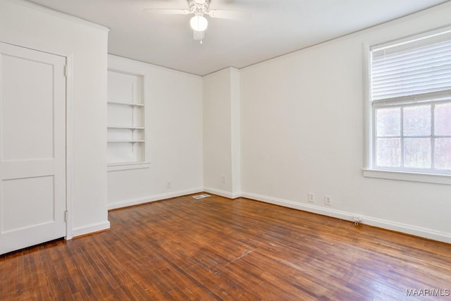 533 Morningview Dr, Montgomery, AL 36109 - empty room featuring a ceiling fan, wood finished floors, and built in features