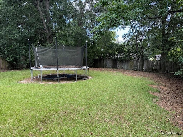 6119 Hinchcliff Rd, Montgomery, AL 36117 - fenced backyard with a trampoline