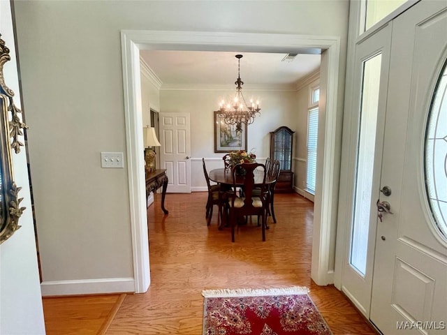 9865 Wynchase Cir, Montgomery, AL 36117 - foyer featuring a chandelier, light wood-type flooring, and ornamental molding