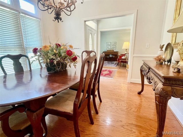9865 Wynchase Cir, Montgomery, AL 36117 - dining area featuring a chandelier and light wood-type flooring