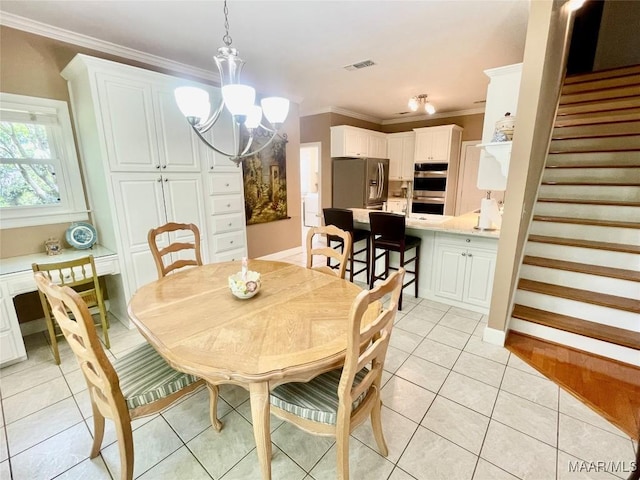 9865 Wynchase Cir, Montgomery, AL 36117 - dining room with ornamental molding, a chandelier, light tile patterned floors, and stairs