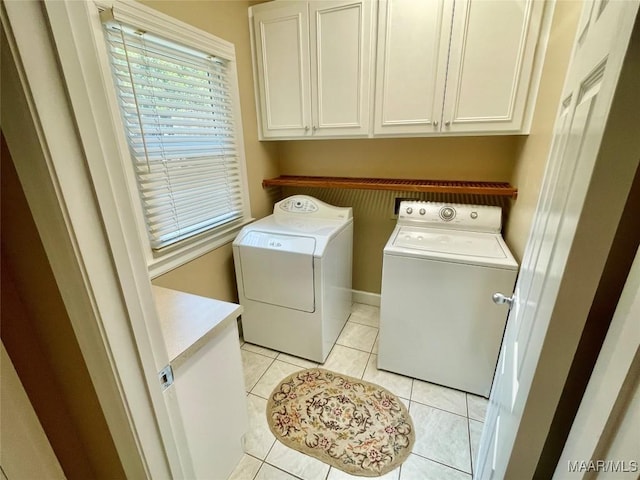 9865 Wynchase Cir, Montgomery, AL 36117 - laundry room with washing machine and dryer, cabinet space, and light tile patterned floors