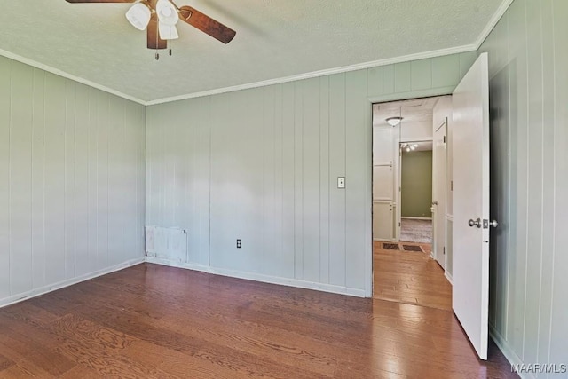 445 W Hickory Grove Rd, Lapine, AL 36046 - spare room featuring dark wood-style floors, ceiling fan, crown molding, and a textured ceiling