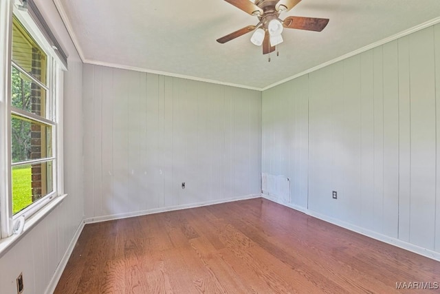 445 W Hickory Grove Rd, Lapine, AL 36046 - empty room featuring wood finished floors, healthy amount of natural light, a ceiling fan, and ornamental molding