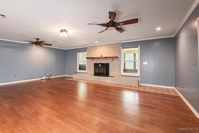 445 W Hickory Grove Rd, Lapine, AL 36046 - unfurnished living room featuring ceiling fan, wood finished floors, crown molding, a brick fireplace, and recessed lighting