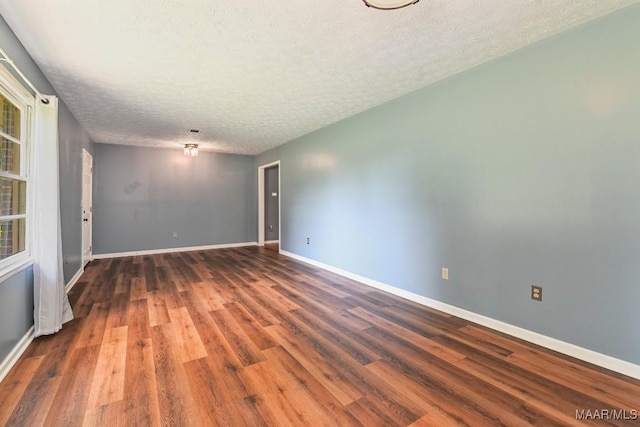445 W Hickory Grove Rd, Lapine, AL 36046 - unfurnished room featuring wood finished floors and a textured ceiling