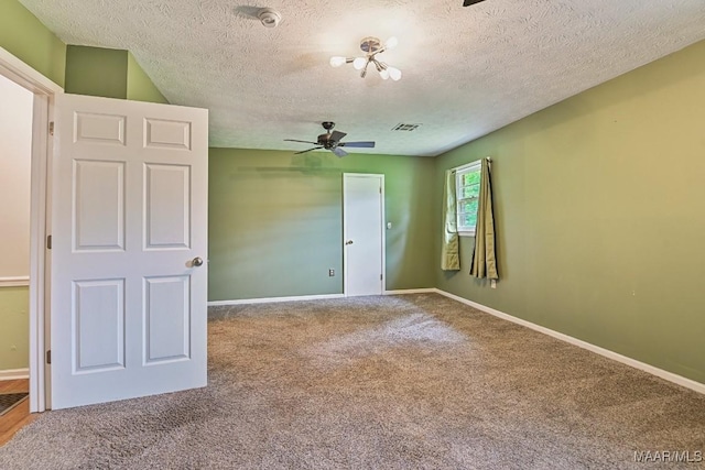 445 W Hickory Grove Rd, Lapine, AL 36046 - empty room featuring carpet flooring, a ceiling fan, a textured ceiling, and a smoke detector