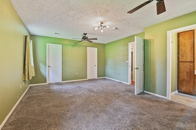 445 W Hickory Grove Rd, Lapine, AL 36046 - unfurnished bedroom with carpet flooring, a textured ceiling, and ceiling fan