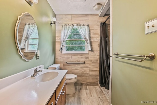 445 W Hickory Grove Rd, Lapine, AL 36046 - bathroom with plenty of natural light, vanity, curtained shower, and a textured ceiling