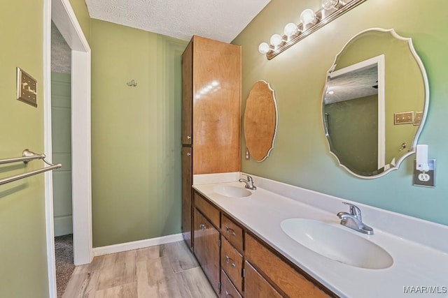 445 W Hickory Grove Rd, Lapine, AL 36046 - bathroom featuring double vanity and a textured ceiling