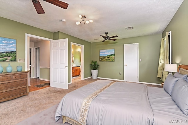 445 W Hickory Grove Rd, Lapine, AL 36046 - carpeted bedroom with ensuite bathroom and ceiling fan