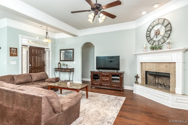 204 Village Way, Wetumpka, AL 36093 - living room with arched walkways, a ceiling fan, wood finished floors, a fireplace, and crown molding