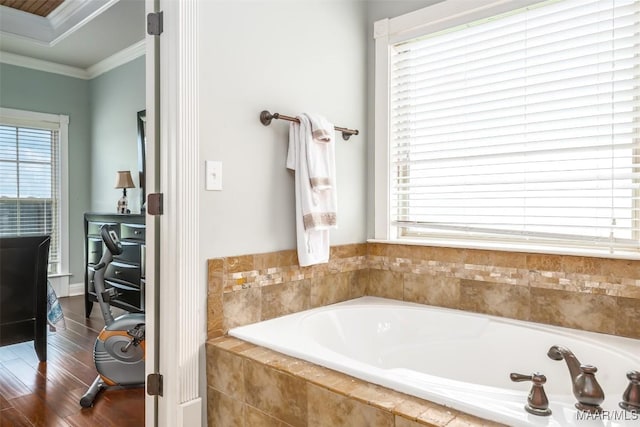 204 Village Way, Wetumpka, AL 36093 - bathroom featuring ornamental molding, a garden tub, healthy amount of natural light, and wood finished floors