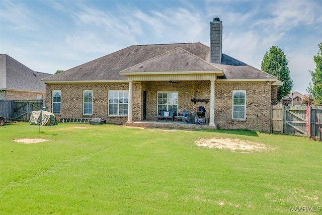 204 Village Way, Wetumpka, AL 36093 - rear view of property with a fenced backyard, a chimney, a patio, and brick siding