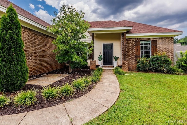 205 Jennifer Ln, Deatsville, AL 36022 - view of front of house with a front yard and brick siding
