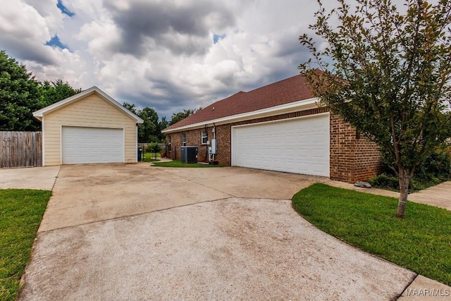 205 Jennifer Ln, Deatsville, AL 36022 - view of front of property with brick siding and a detached garage