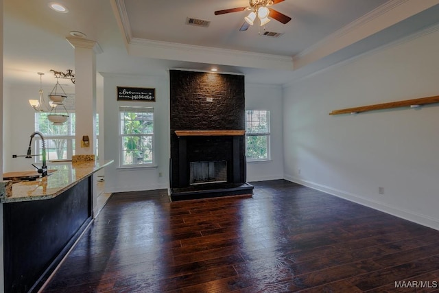 205 Jennifer Ln, Deatsville, AL 36022 - living room with healthy amount of natural light, dark wood-style flooring, ceiling fan, a large fireplace, and ornamental molding