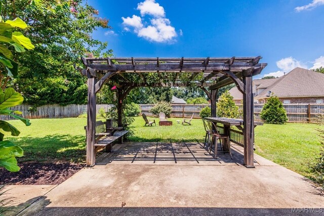 205 Jennifer Ln, Deatsville, AL 36022 - fenced backyard with a pergola, a patio area, and outdoor dining area