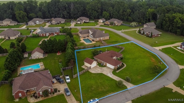 205 Jennifer Ln, Deatsville, AL 36022 - aerial view of residential area featuring a pool area and property parcel outlined