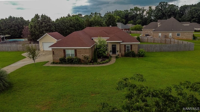 205 Jennifer Ln, Deatsville, AL 36022 - single story home with brick siding, driveway, and a garage