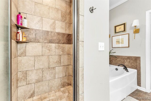 447 Galloway Dr, Wetumpka, AL 36093 - full bathroom featuring crown molding, a bath, and a tile shower