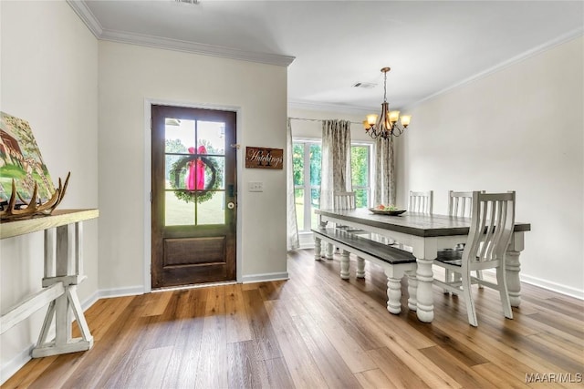 447 Galloway Dr, Wetumpka, AL 36093 - foyer with a chandelier, crown molding, and wood finished floors