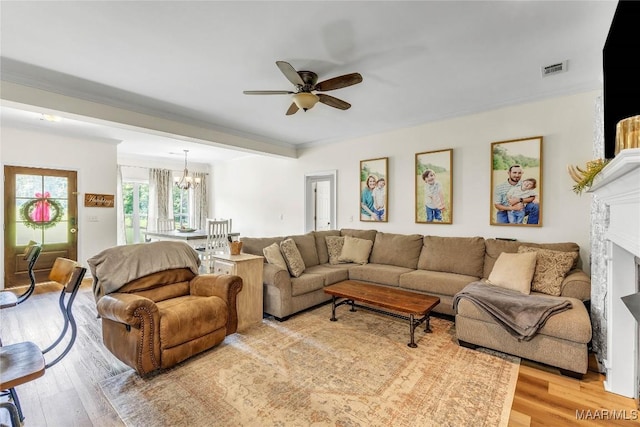 447 Galloway Dr, Wetumpka, AL 36093 - living room featuring a chandelier, ceiling fan, and light wood finished floors