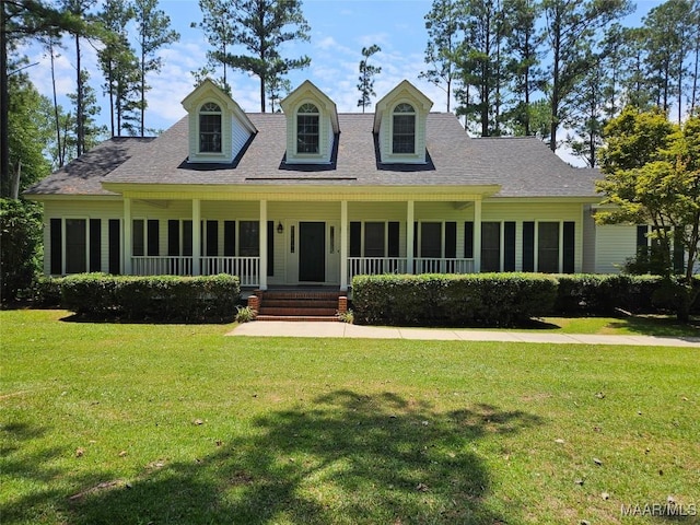 2714 Luverne Hwy, Greenville, AL 36037 - cape cod-style house with a front yard, a porch, and roof with shingles