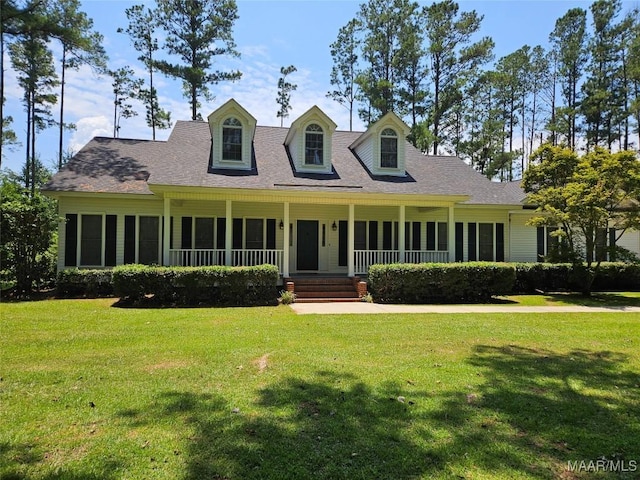 2714 Luverne Hwy, Greenville, AL 36037 - cape cod house featuring a front lawn, covered porch, and a shingled roof