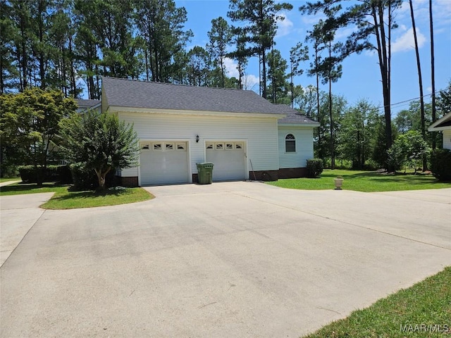 2714 Luverne Hwy, Greenville, AL 36037 - view of home's exterior with driveway, a lawn, an attached garage, and a shingled roof