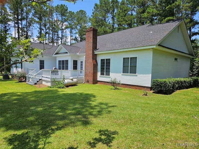 2714 Luverne Hwy, Greenville, AL 36037 - rear view of house with a chimney, a lawn, a deck, and roof with shingles