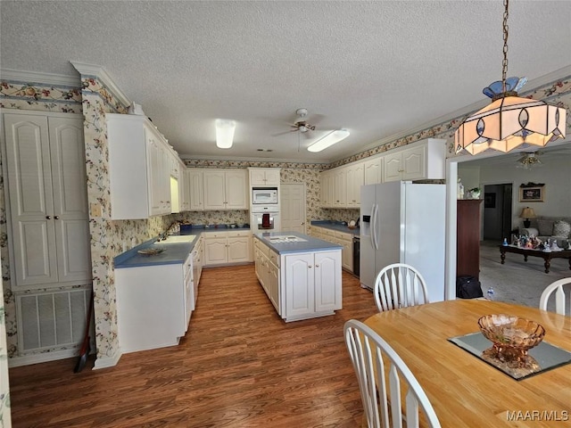 2714 Luverne Hwy, Greenville, AL 36037 - kitchen with white appliances, dark countertops, a textured ceiling, ornamental molding, and ceiling fan