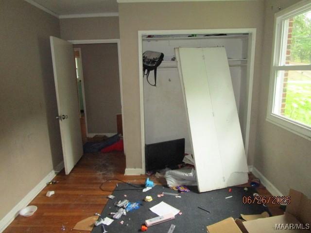 238 Easthaven Rd, Montgomery, AL 36109 - unfurnished bedroom featuring a closet, wood finished floors, and crown molding