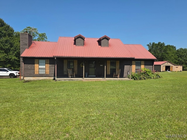 973 Pettus Rd, Lapine, AL 36046 - back of property featuring a lawn, a metal roof, and a chimney