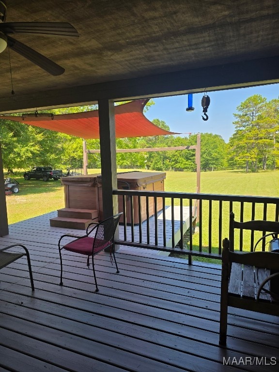 973 Pettus Rd, Lapine, AL 36046 - wooden deck featuring a hot tub, a ceiling fan, and a lawn