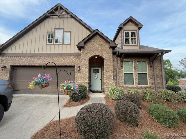 178 Natures Trl, Wetumpka, AL 36093 - view of front of home with brick siding, board and batten siding, driveway, and a garage